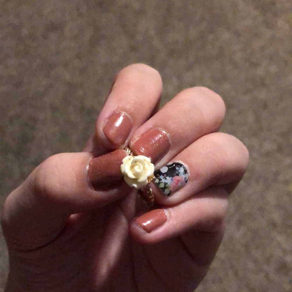 Gold ring with white rose